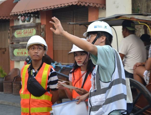 The University of Hong Kong and University of Northern Philippines student teams discuss conditions in the heritage city of Vigan, Ilocos Sur.